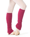 Fuchsia long leg warmers worn over ballet slippers.