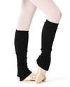 Metallic black knit leg warmers worn over tights.