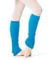 Turquoise 60 cm knit leg warmers worn over tights and ballet slippers.