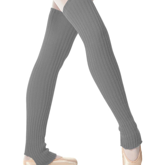 Grey stirrup knit dance leg warmers worn over ballet tights