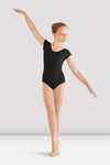 Front view of girls black cap sleeve ballet leotard worn by young dancer