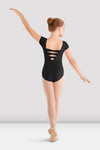 Young ballet dancer wearing a black girls cap sleeve leotard with triple bow back detail