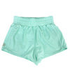 Mint green flowy dance shorts laid flat.