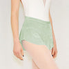Adult ballet dancer wearing a mint pull-on ballet skirt over a leotard