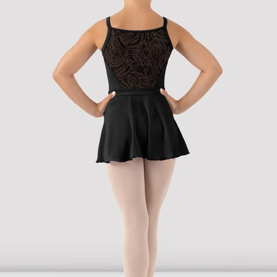 Girl wearing black skirted camisole leotard back view