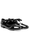 Black patent leather tap shoe shown from side angle