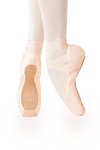 Dancer wearing Gaynor Minden Europa Sculpted Fit ExtraFlex pointe shoes with deep vamp and high heel, shown en pointe against a white background.