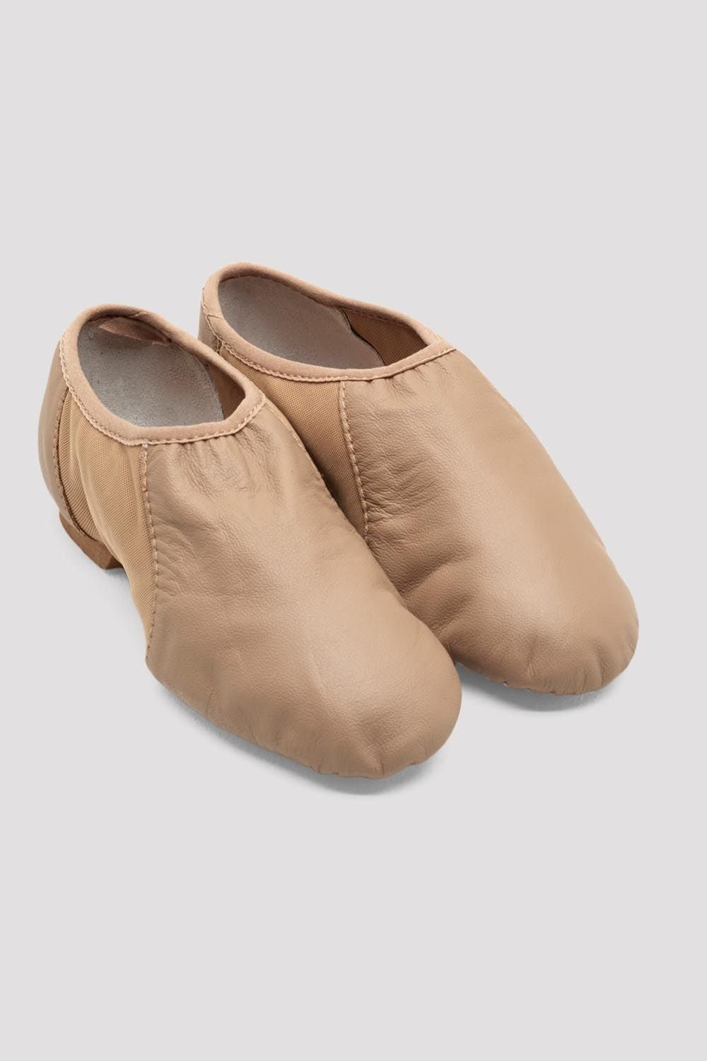 Tan slip-on leather jazz shoes shown as a pair on a white background.