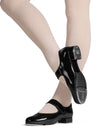Child wearing black Bloch tap shoes with Velcro strap while dancing