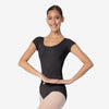 Dancer wearing black cap sleeve leotard with rounded neckline, front view