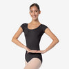 Front view of a black adult cap sleeve leotard with a rounded neckline worn with ballet tights