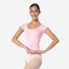 Dancer wearing light pink cap sleeve leotard, front view
