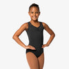 Child wearing black tank leotard with pinch front and mesh back detail, front view