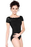 Dancer wearing a black cap sleeve leotard with lace neckline