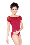 Dancer wearing a red cap sleeve leotard with lace neckline detail
