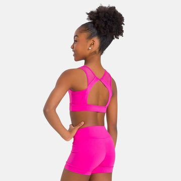 SoDanca Sloane's Kid's Top in black with mesh halter straps and open-back design, modeled with black dance shorts