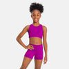 Young dancer wearing raspberry mesh-strap dance top with coordinating shorts