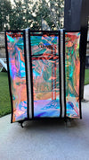 Back view of iridescent rolling dance tote standing upright outdoors