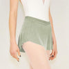 Adult ballet dancer wearing a soft green pull-on ballet skirt over a leotard