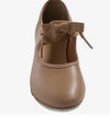 Top view of caramel child tap shoe showing rounded toe and strap