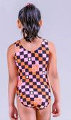Back view of a pink gymnastics leotard featuring a checkerboard pattern with spooky-themed graphics.