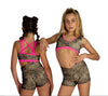 Two young dancers wearing cheetah print shorts and pink criss cross back crop tops, shown from the front and back