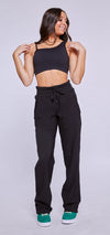 Black cropped dance top worn by a dancer standing facing forward