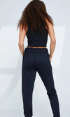 Black adult jogger pants shown from the back on a dancer
