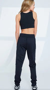 Black child jogger pants shown from the front on a dancer