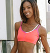 Pink dance top worn by a model, shown from the front