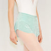 Adult ballet dancer wearing a soft teal pull-on ballet skirt over a leotard