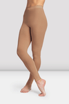 Child dancer wearing tan footless dance tights, front view