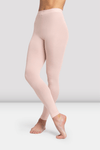 Child dancer wearing pink footless dance tights, side view