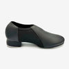 Side view of black slip-on tap shoe showing heel and sole