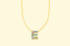 Additional product image showing a colorful confetti letter necklace.
