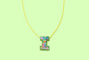 Additional product image showing a colorful confetti letter necklace.