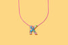 Additional product image showing a colorful confetti letter necklace.