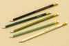 Five Taylor Elliott camo pencils with gold foil text on light background