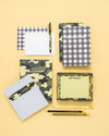 Taylor Elliott camo and gingham pen set displayed with matching stationery items