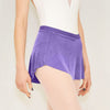 Adult ballet dancer wearing a purple pull-on ballet skirt over a leotard