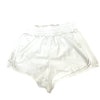 White flowy dance shorts laid flat.
