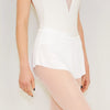 Adult ballet dancer wearing a white pull-on ballet skirt over a leotard