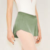 Adult ballet dancer wearing a eucalyptus green pull-on ballet skirt over a leotard 