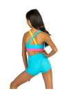 Young dancer wearing blue V-waist dance shorts with a matching top, shown from the back.