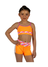 Dancer wearing an orange XO Dance Co crop top with matching shorts