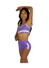 Dancer wearing a purple and pink XO Dance Co crop top with matching shorts