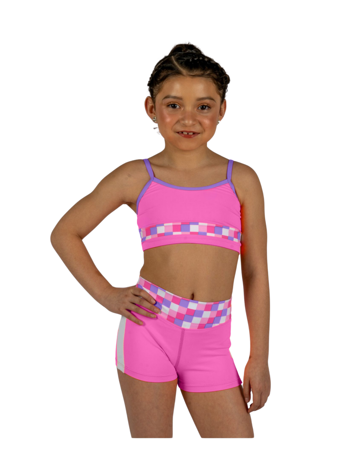 Dancer wearing a pink XO Dance Co crop top with matching shorts