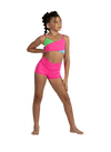Young dancer wearing pink V-waist dance shorts with matching top, posing with one arm raised.