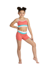 Young dancer wearing a teal and coral crop dance top with matching bottoms