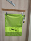 Lime green mesh FTT logo shoe bag hanging on rack
